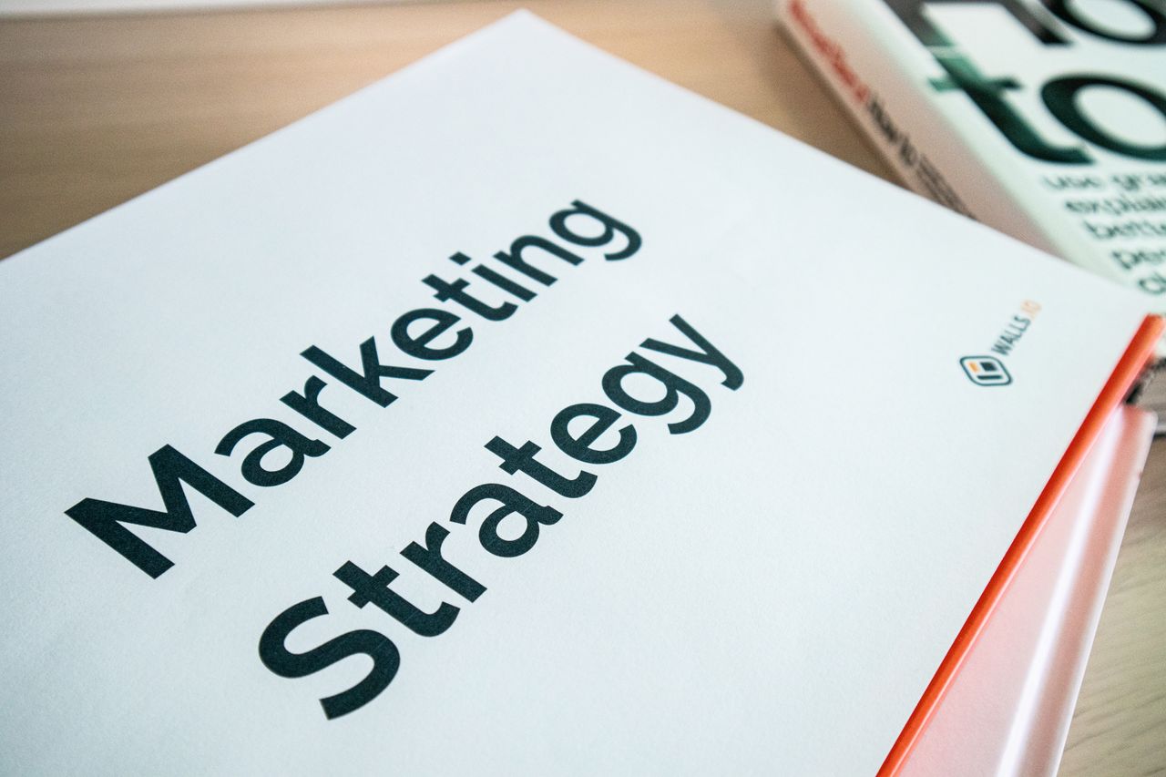 A close-up view of a marketing strategy document resting on a desk, perfect for business-related content.